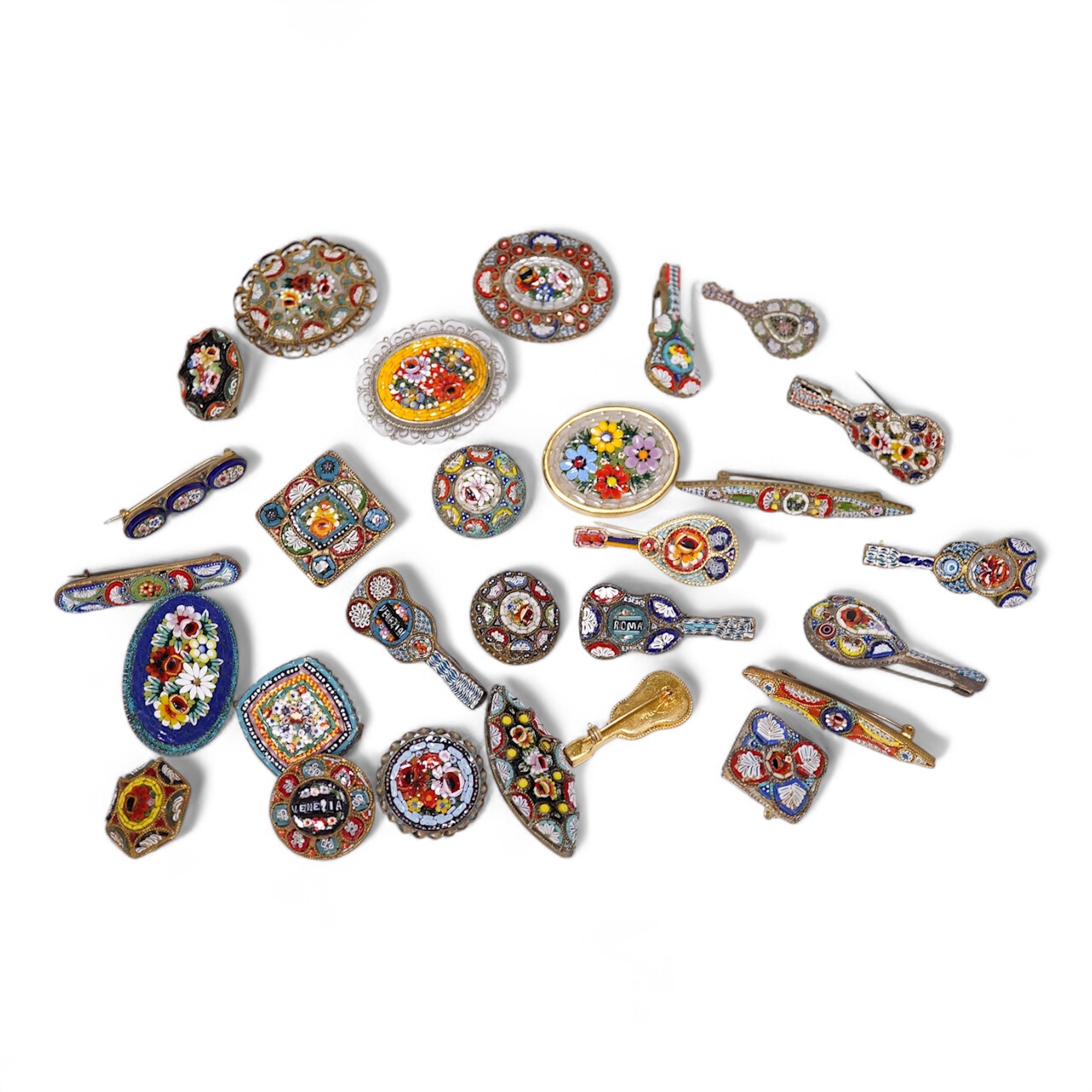 A collection of twenty-eight micro-mosaic brooches, including ten banjo and guitars shaped brooches, six similar large oval brooches, nine small brooches and three long brooches. (28) Condition - good
